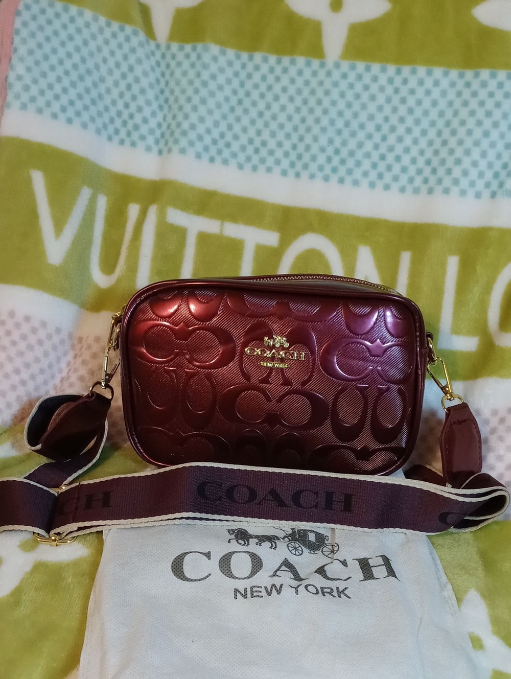 COACH Metallic Burgundy Signature Embossed Crossbody Bag with Wide Strap